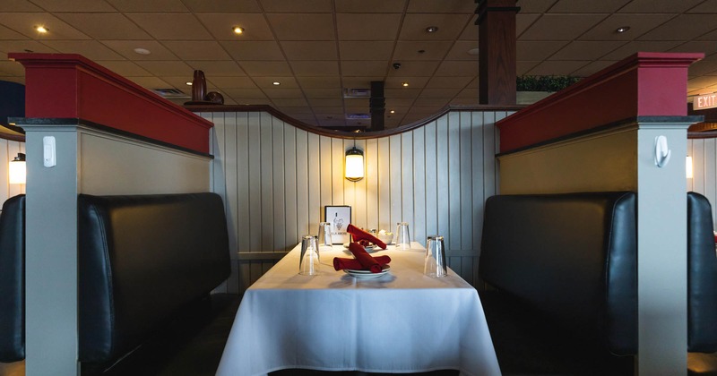 Interior, dining booth partitions with set tables