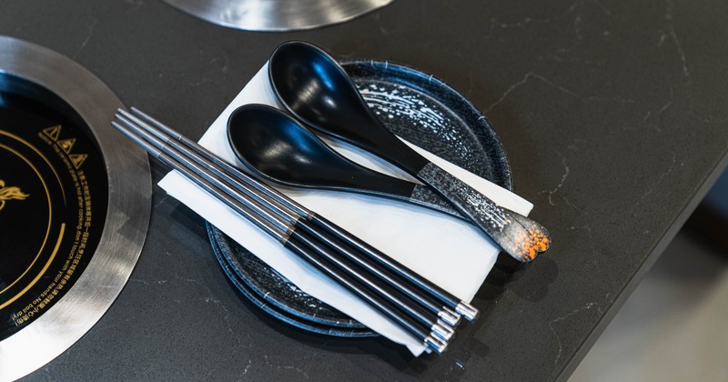 Interior, table set for guests in dining area