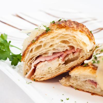 Croissant with ham, Swiss cheese, and Bechamel sauce.