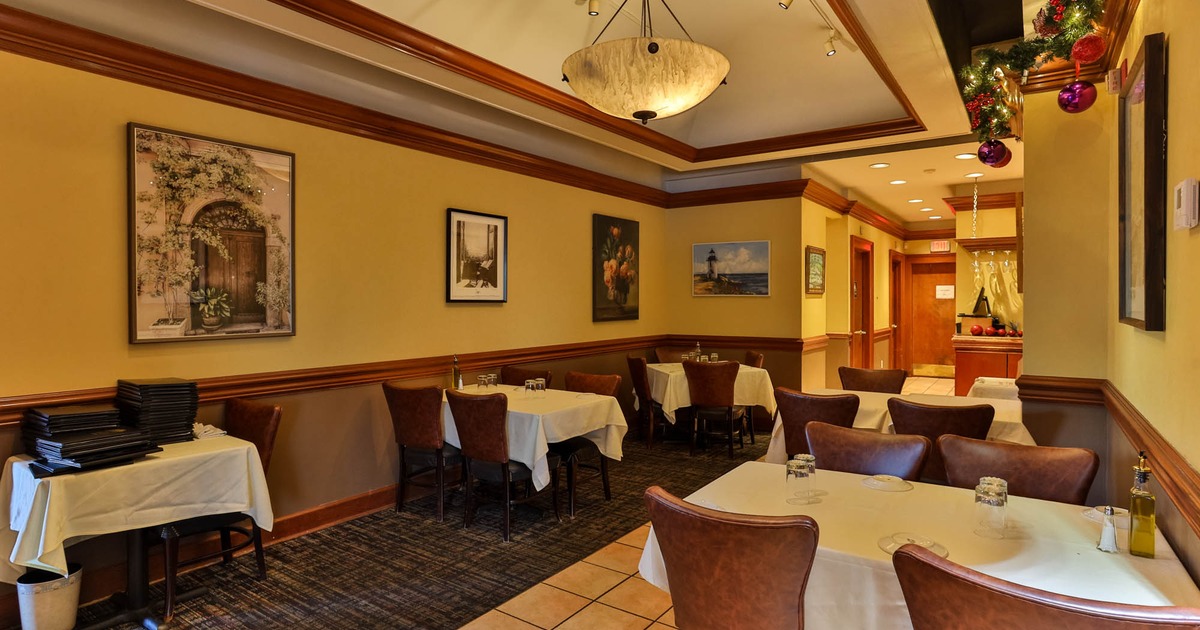 Interior, dining area, white cloth tables with chairs, Christmas decoration