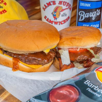 Two burgers and a bag of BBQ chips.