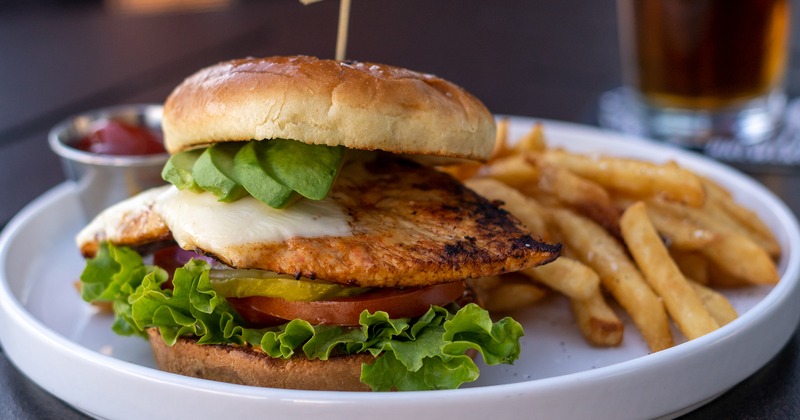 Blackened Chicken sandwich, served with fries and tomato sauce dip
