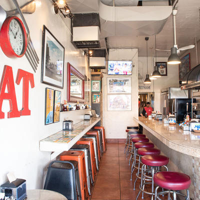 Restaurant interior, chairs lined up at the bar