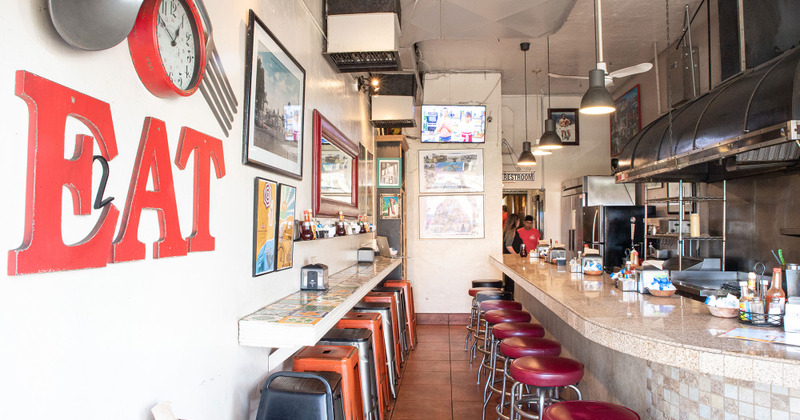 Restaurant interior, chairs lined up at the bar