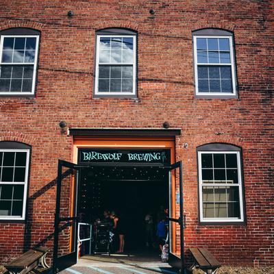 An exterior shot of the rear entrance and glass double doors.