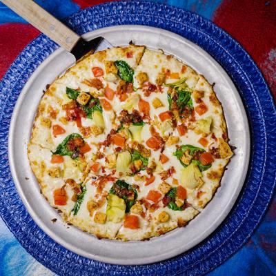 Chicken Alfredo pizza, top view.