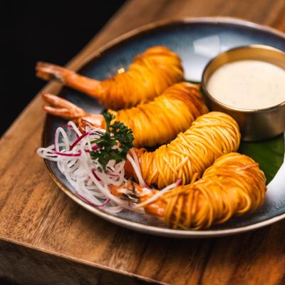 Angel Shrimp wrapped in noodles, serrved with a dipping sauce.