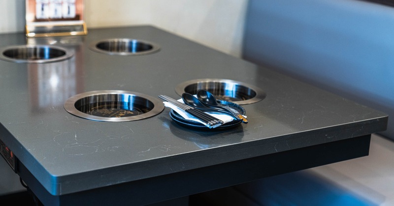 Interior, hot pot table in dining area