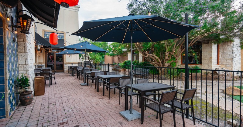 Exterior, tables and chairs with parasols on patio