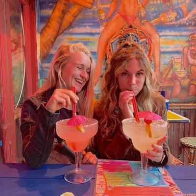 Two guests enjoying their cocktails