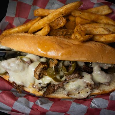 Big Fat Philly cheese steak sandwich with fries.