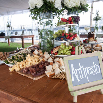 Antipasto sign and a variety of foods