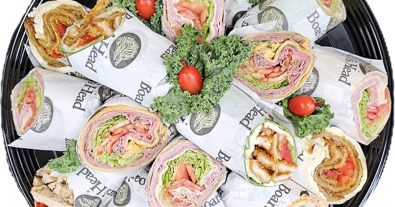 A platter of assorted wrap sandwiches