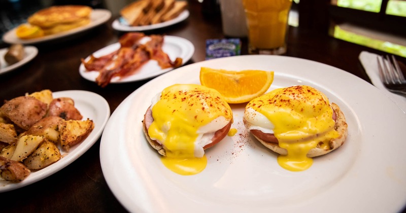 Two eggs Benedict and home fries