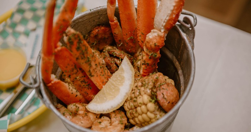 Seafood boil with crab legs served in a bucket