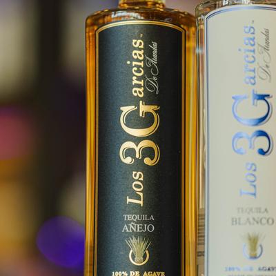 Close-up of two tequila bottles.