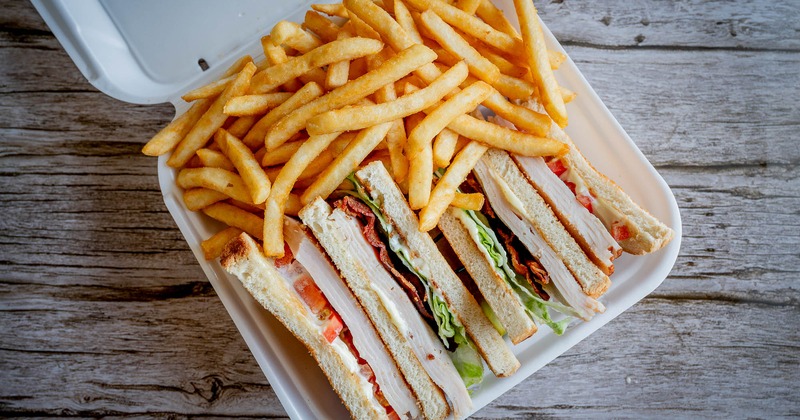 Turkey Club Sandwich and fries