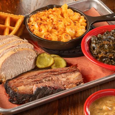 Smoked brisket, chicken, collard greens, and mac and cheese.