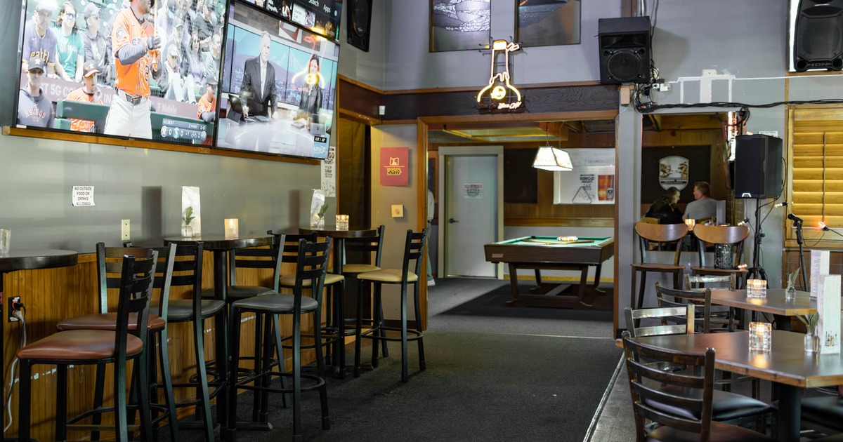 Seating area, TV screens showing sports