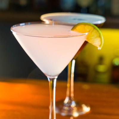 Cosmopolitan and Espresso Martini served on a bar counter.