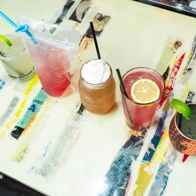 Variety of cocktails served on a marble table.