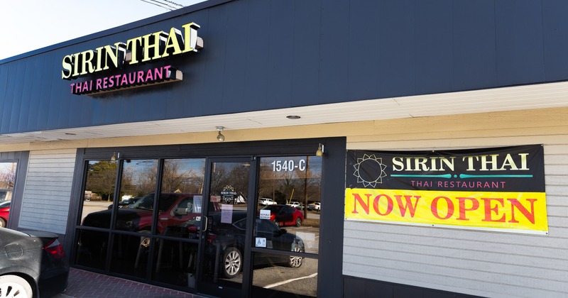 Exterior, front of restaurant, angle view, entrance, sign above