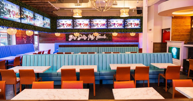 Interior, tables, chairs, upholstered benches, lighting, wall LED screens