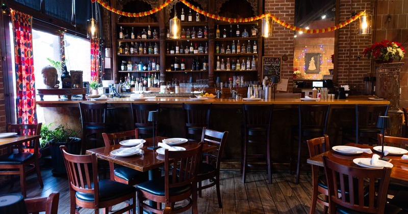 Interior, a bar with bar stools in the back