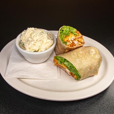 Buffalo chicken wrap with cheese, lettuce, tomato, bleu cheese dressing and side of coleslaw.
