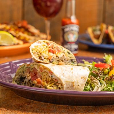 Black bean burrito, with rice, and tomatoes.