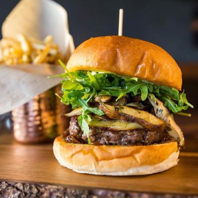 Mushroom cheeseburger and fries.