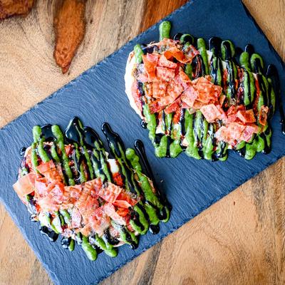 Cheesy toast, with pesto, balsamic, and bacon.
