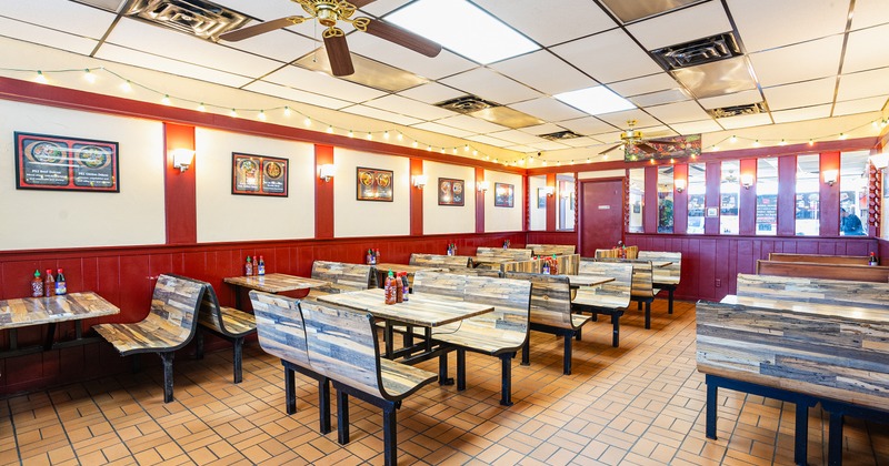Interior dining area with wooden tables and benches