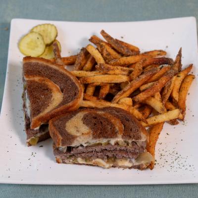 Patty melt sandwiches with fries.