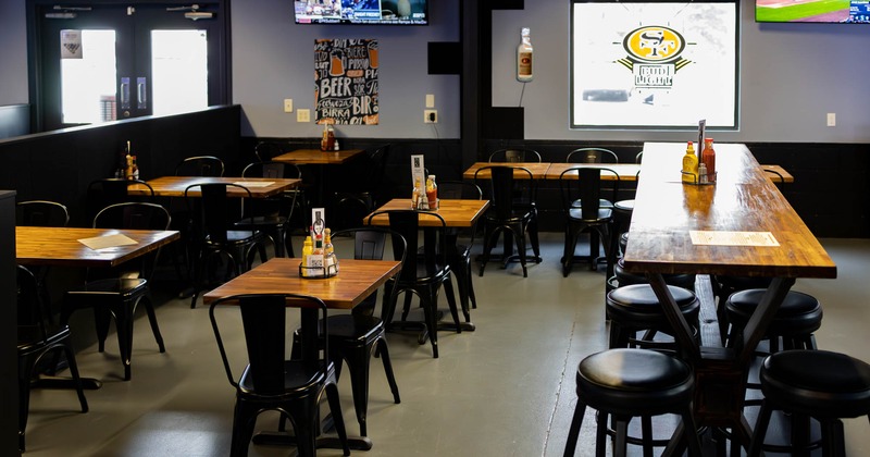 Dining area, tall table and bar stools on the right