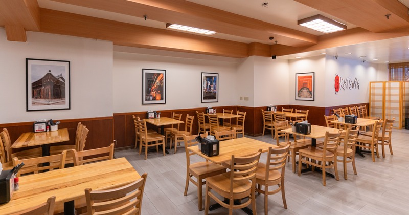 Dining area with wooden tables and chairs