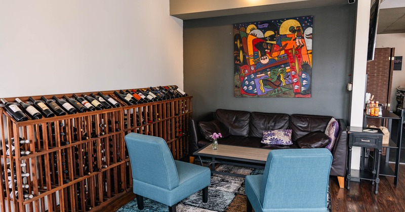 Wine rack, sofa, and armchairs