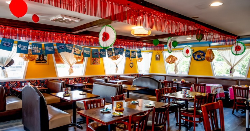 Interior, dining area with colorful decor on the walls and ceiling