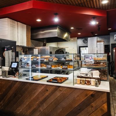 Glass display cases with food on the serving counter.