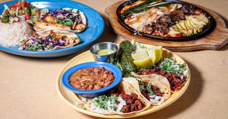 Three different traditional dishes served on a table