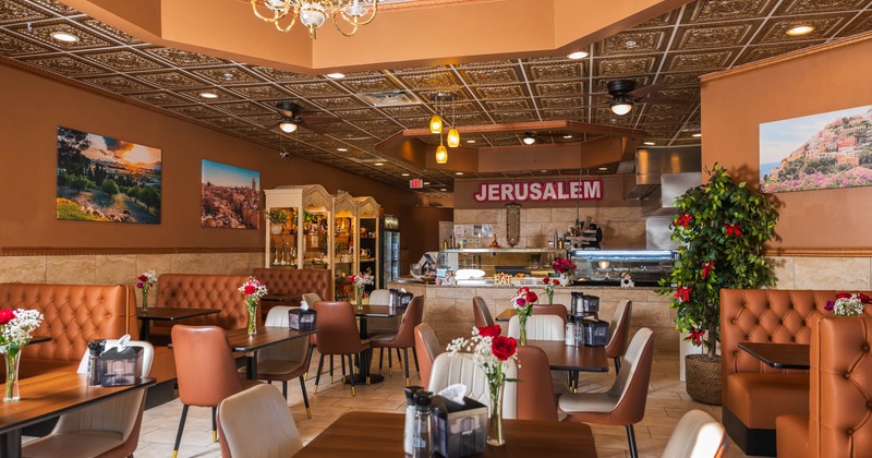 Interior, dining area, tables with chairs, seating booths, checkout counter and cold display cases