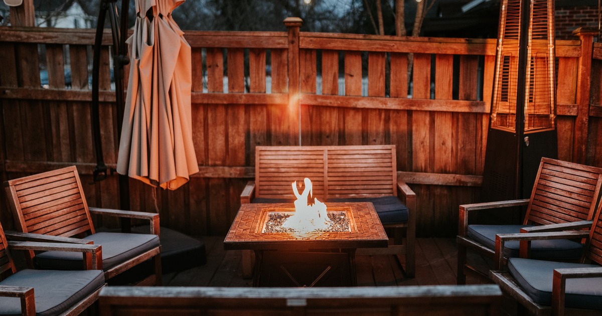 A fire pit with seating  outside