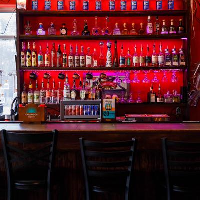 Bar area, various bottles on the shelf.