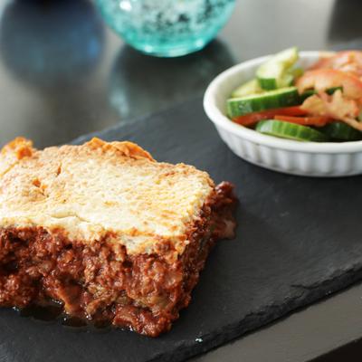 Moussaka, with plant based beef, stew tomatoes, eggplant layers, and bechamel sauce.