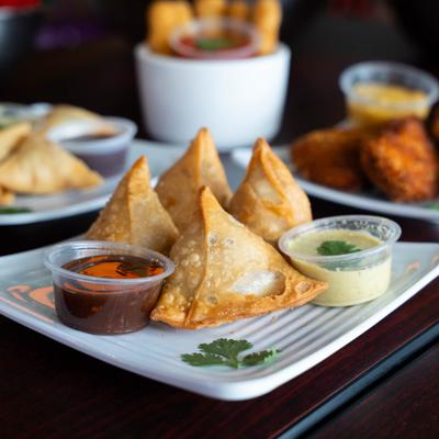 Crispy samosas and dip.