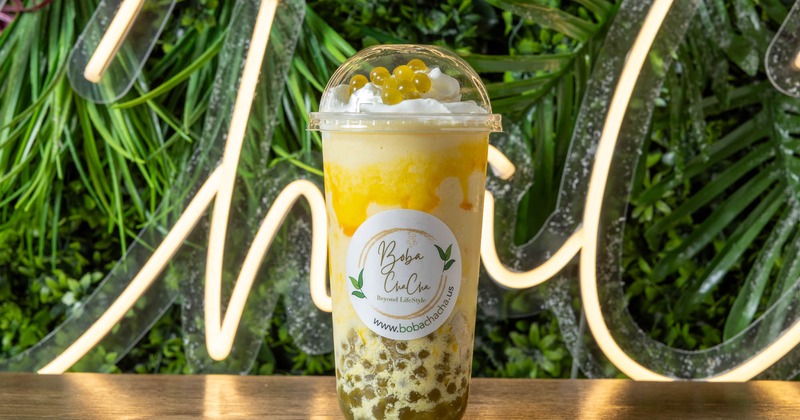 Mango-peach smoothie in a branded cup