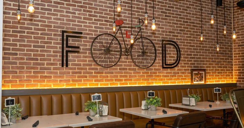 Interior, seating area with tables, wall decoration