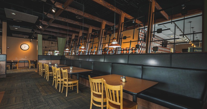 Interior, tables with chairs and banquette seating