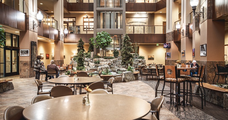 Interior, diner area, tables and chairs, fountain behind