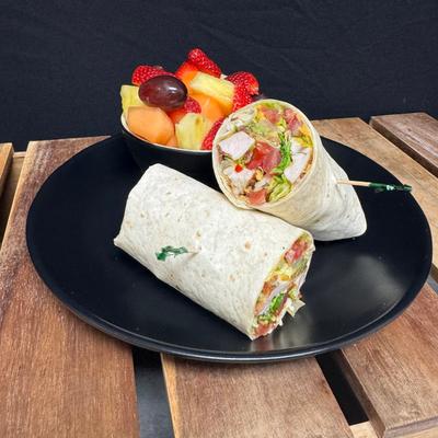 Honey lime Chicken Wrap and fresh fruit.